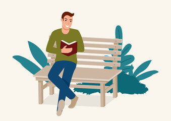 Man sitting on wooden bench while concentrated reading a book