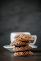 Fototapeta na wymiar a cup of coffee with oatmeal cookies