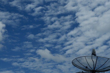 satellite dish antenna against blue sky