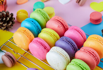 Colorful macarons dessert with vintage pastel tones. Colorful French macarons background, Different...