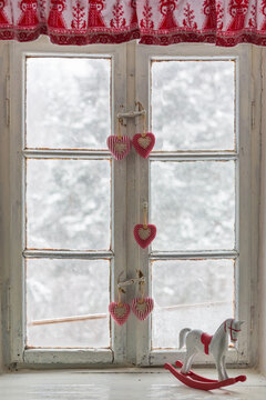 View From Old Wooden White Window On Snowfall And Winter Forest And Trees