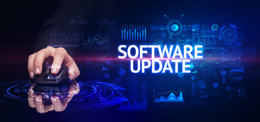 hand holding wireless peripheral with SOFTWARE UPDATE inscription, modern technology concept