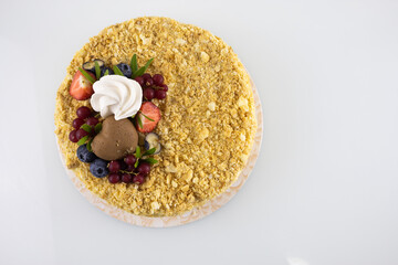 layered cake with berries top view on white table