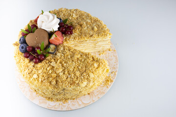 the cake is decorated with strawberries and marshmallows, from which a slice has been cut