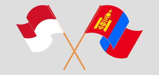 Crossed and waving flags of Indonesia and Mongolia