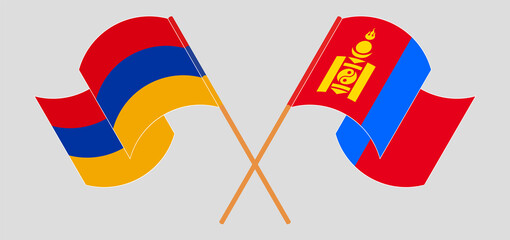 Crossed and waving flags of Armenia and Mongolia