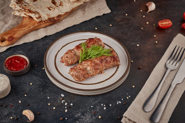 Grilled lula kebab, textured dark background