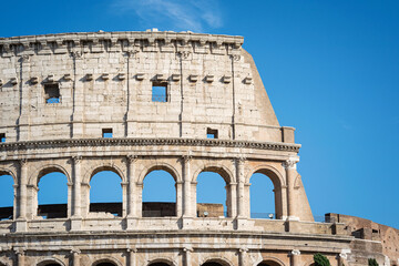 Obraz premium Architectural details on a facade of the Coliseum in Rome, Italy. Rome ancient arena of gladiator fights.