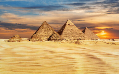 Pyramids of Egypt at sunset, famous Wonder of the World, Giza