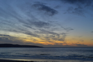 Fototapeta na wymiar Living the dream Sunset Sea Surf St Ives Gwithian Cornwall
