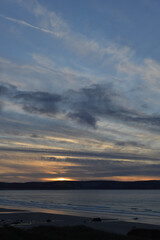 Fototapeta na wymiar Living the dream Sunset Sea Sand Surf St Ives Gwithian Cornwall