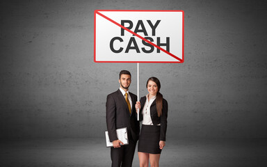 business person holding a traffic sign with PAY CASH inscription, new idea concept