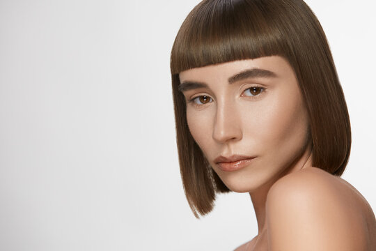 pretty young lady with nude make-up and staright hairstyle