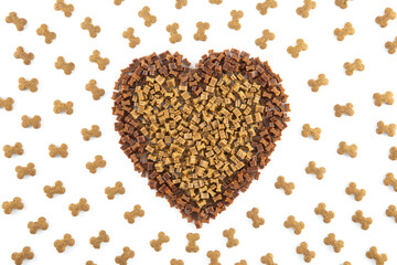 Dried animal pet dog food in heart form isolated on white background . Dog love dry food Biscuits