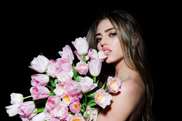 Fashion young woman with tulips flowers bouquet.