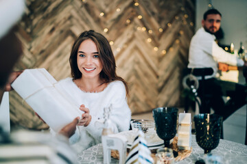 Woman receiving gift at Christmas