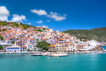 View of town and port at the island Skopelos, northern Sporades, Greece - obrazy, fototapety, plakaty