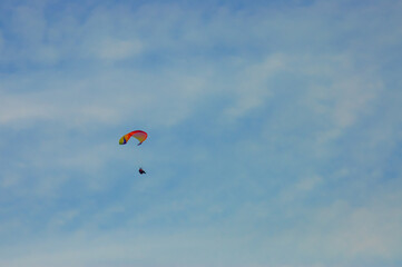 paraglider on the blue sky background