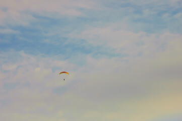 paraglider on the blue sky background