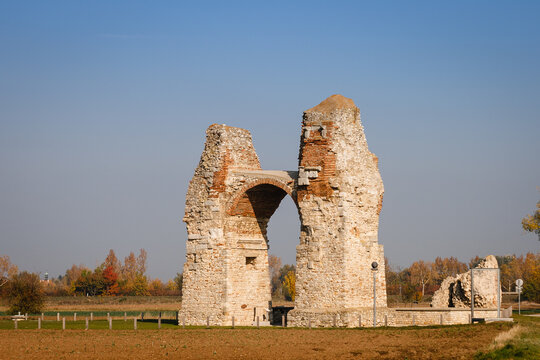 View of the old Roman Gate at Carnuntum, Austria under a clear blue sky background