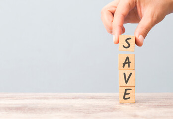 The word save is written on wooden cubes that are piled up