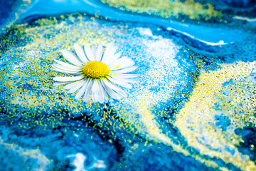Fototapeta na wymiar Selective focus. Close-up fragment of acrylic liquid painting with floating daisy. Modern art. Contemporary art. Natural luxury. Abstract art wallpaper. Trendy background