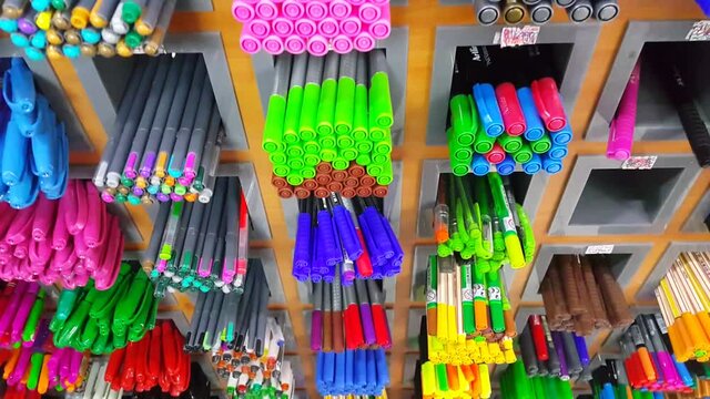 Pens of various colors on the stationery shelf