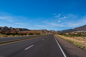Highway on travel vacation. Panoramic skyline with empty road.
