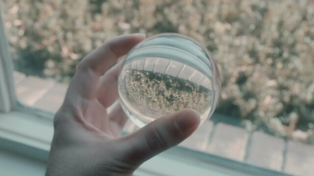 holding a crystal ball