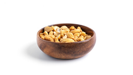 Cashews in wooden bowl isolated on a white background.