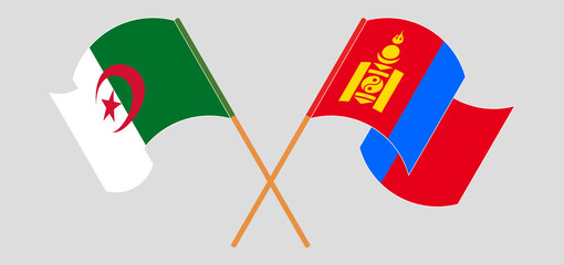 Crossed and waving flags of Algeria and Mongolia