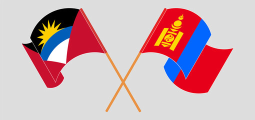 Crossed and waving flags of Antigua and Barbuda and Mongolia