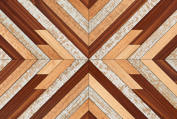 Colorful wooden wall with chevron pattern made of narrow hardwood planks. Wood texture background.