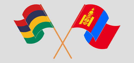 Crossed and waving flags of Mauritius and Mongolia