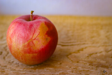 Red apple stand on a wooden surface