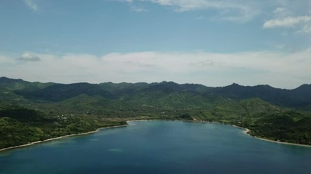 aerial seascape, tropical vacation and island hopping concept. Gilli air island and Lombok . Indonesia, south Gili islands. Gili Asahan island. A strip of sand on the beach and blue sea with corals