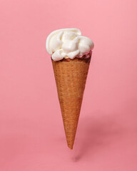 vanilla ice cream waffle cone isolated on pink background
