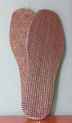 a pair of large size insoles in winter shoes