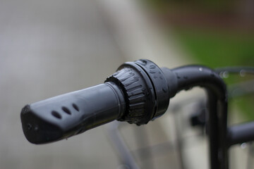 Black bicycle handlebar with rain drops