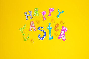 Yellow background with toys for Easter