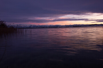 Fototapeta na wymiar Colorful sunset over the lake of pfaeffikon (Pfäffikersee)