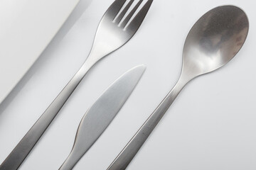 Minimal designed inox cutlery isolated on white background