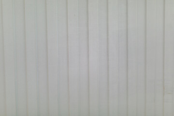 texture of a white fence made of metalprofile