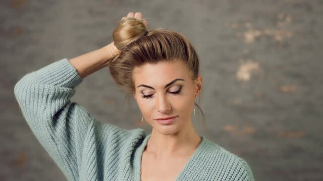 Beautiful caucasian blonde woman showing off long hair