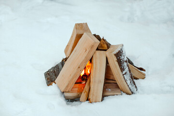 Winter Picnic. Bonfire in the snow. Horizontal image.