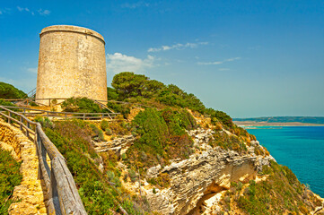 Fototapeta na wymiar View of coastline and watch tower in the La Brena National Park, located in the Southern Spain ,halfway between Mediterranean and Atlantic waters