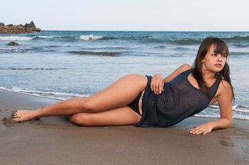 Fototapeta na wymiar very sexy young woman enjoying the beach in spring or summer