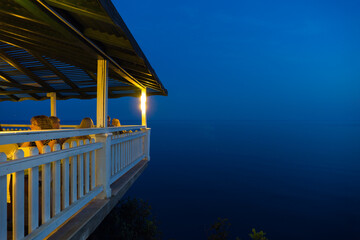Terrace restaurant over the sea at night in Alanya, Turkey