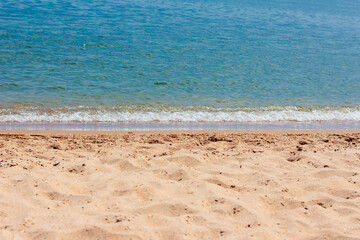 Sandy beach and calm sea . Seaside in the summer