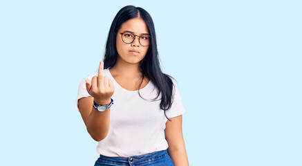 Young beautiful asian girl wearing casual clothes and glasses showing middle finger, impolite and rude fuck off expression